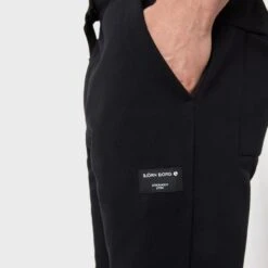BJØRN BORG Björn Borg Tapered Sweatpants Centre Mini Logo Zwart -Boxers Ondergoed Winkel aHR0cHM6Ly93d3cuYm94ZXJzLm5sL21lZGlhL2NhdGFsb2cvcHJvZHVjdC9iL2ovYmpvcm4tYm9yZ18xMDAwNDI0My1iazAwMV8xLmpwZz9zdG9yZT1ib3hlcnNfbmwmaW1hZ2UtdHlwZT1pbWFnZQ